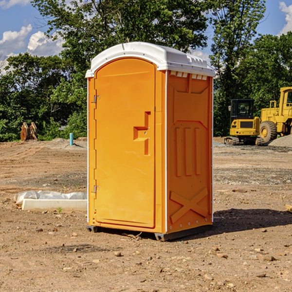 what is the cost difference between standard and deluxe portable restroom rentals in Dundy County